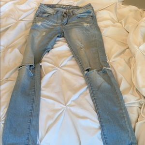 Light blue distressed skinny jeans